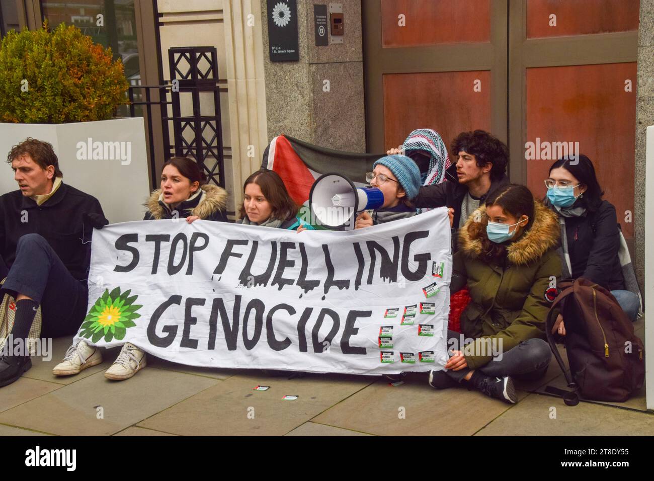 London, UK. 20th November 2023. Climate and pro-Palestine activists from the group Fossil Free London block the entrances to the headquarters of fossil fuel giant BP in Central Londont. Israel has recently granted licences to BP to explore for gas off the Gaza coast while the war rages between Israel and Hamas. Credit: Vuk Valcic/Alamy Live News Stock Photo