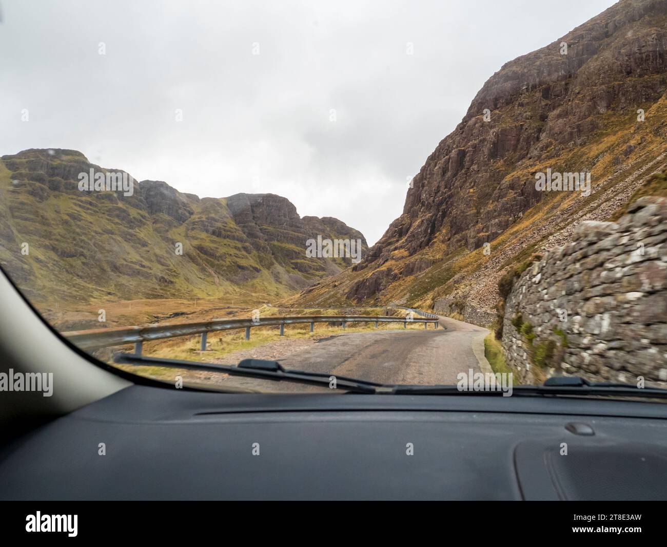 A car driving over the  Bealach na Ba from Loch Kishorn to Applecross, Scotland, UK. Stock Photo