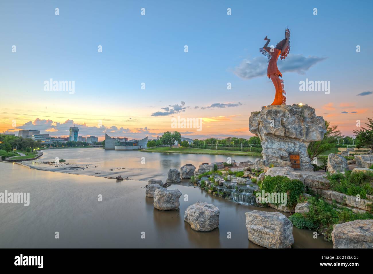 WICHITA, KANSAS - AUGUS 31, 2018: Downtown Wichita at dawn from the Arkansas River and Keeper of the Plains. Stock Photo