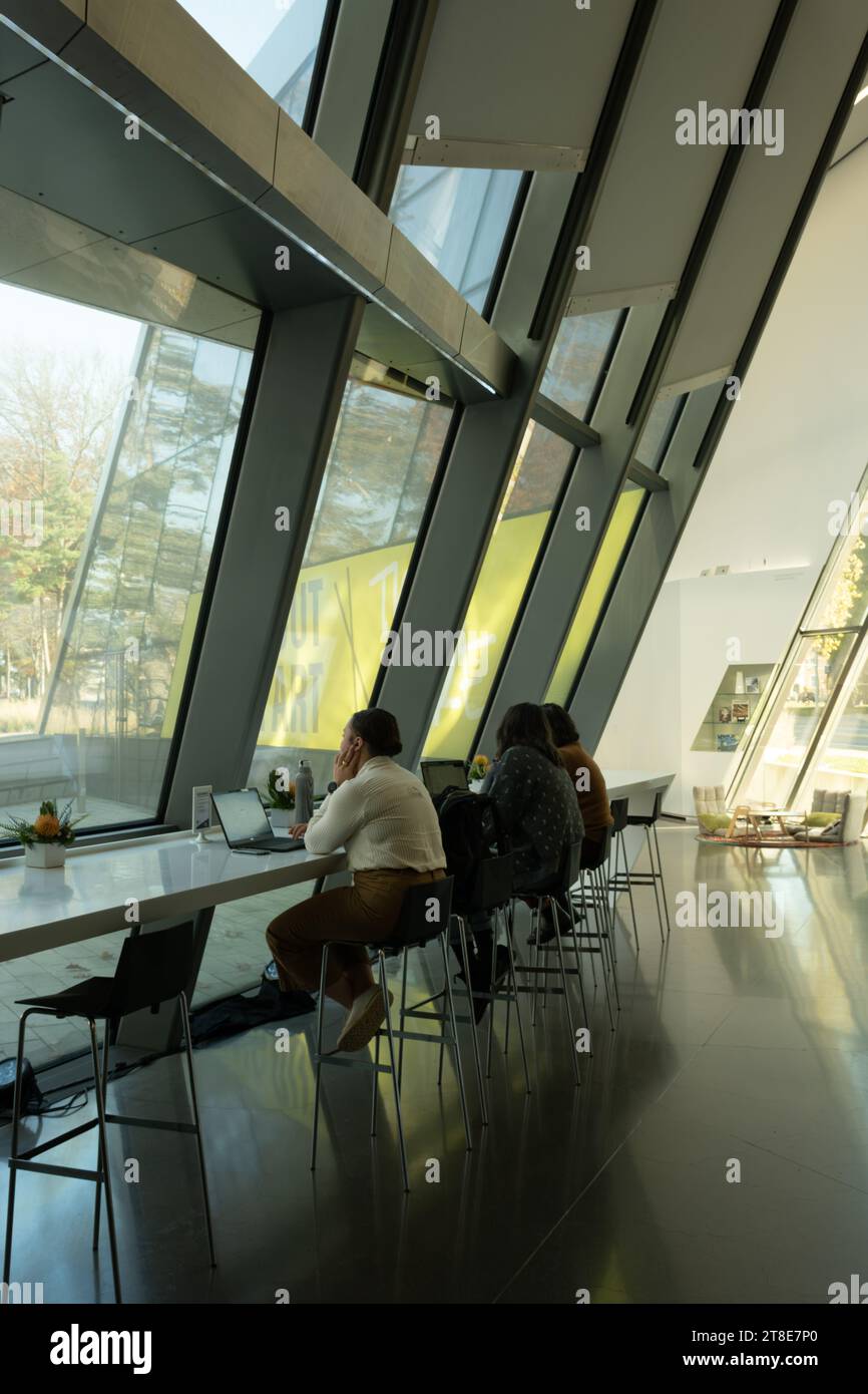 Students working on laptops at the Eli and Edith Broad Art Museum at Michigan State University, East Lansing Michigan USA Stock Photo