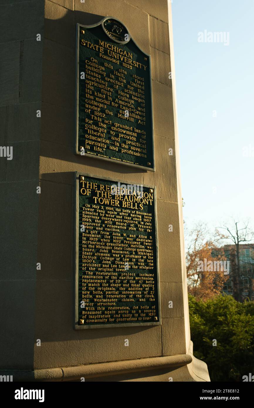 Two plaques on Beaumont Tower describing the founding of MSU and the tower bells, on the campus of Michigan State University, East Lansing Michigan Stock Photo