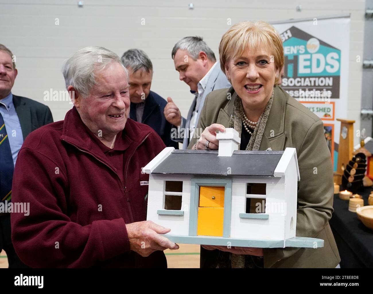 Social protection minister Heather Humphreys meets Tommy Sheridan, 93, from Virginia, who makes bird houses as she visits the Irish Men's Shed Association conference at the Virginia Show Centre in Co Cavan, to announce details of the first tranche of cost of living lump sum payments from Budget 2024, at Picture date: Monday November 20, 2023. Stock Photo