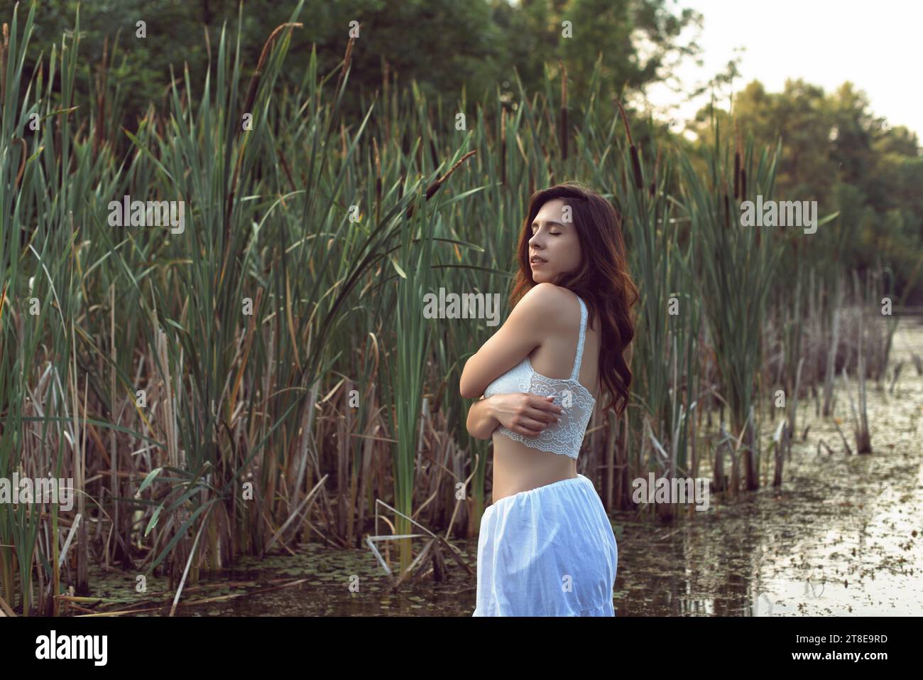 Be healthy Attractive young woman in white bra and panties holding one hand  on hip and pointing you while standing isolated on white 13591616 Stock  Photo at Vecteezy