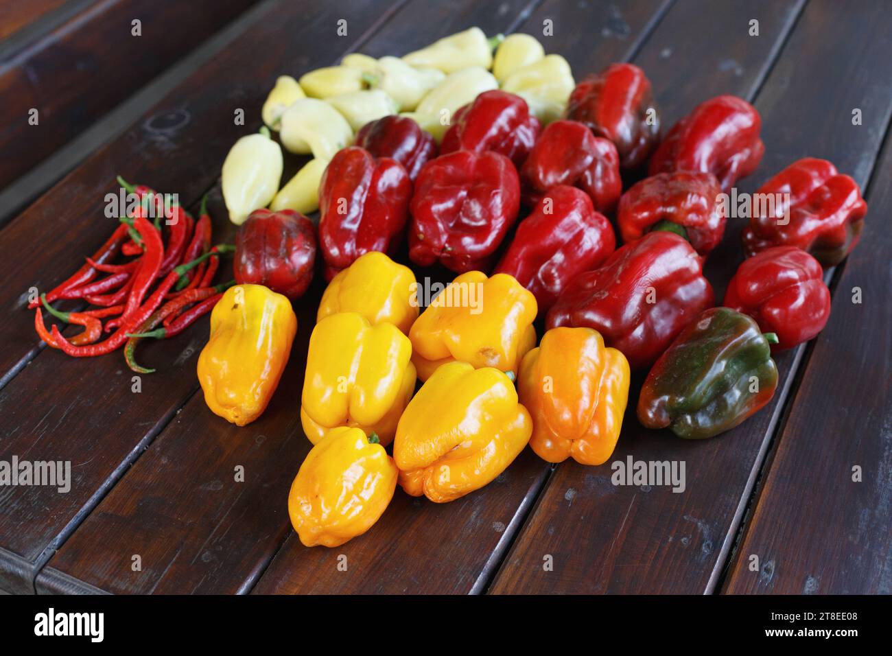 Pepper harvest on the wood table Stock Photo - Alamy