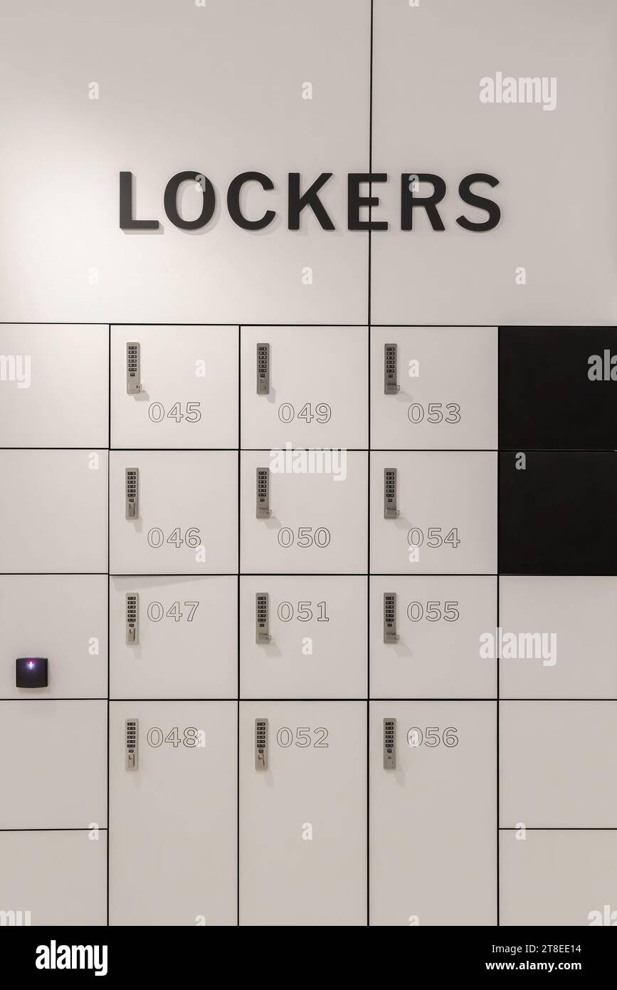 White modern metal storage wall with text Lockers Stock Photo Alamy