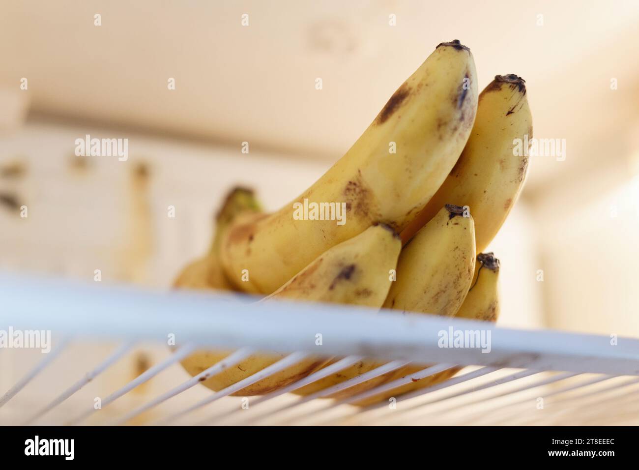 Bunch of bananas on a shelf in the refrigerator Stock Photo Alamy