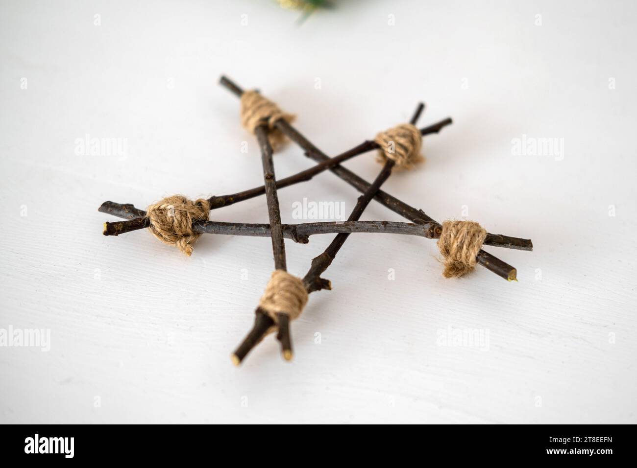 Simple Twig Star. DIY Star Tree Topper. Handmade Christmas Decorations. Easy Idea of Wooden Xmas Decor. Nordic, Boho Scandinavian Style Design. Unique Stock Photo