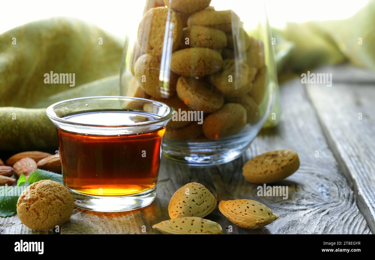 amaretto almond liqueur with fresh nuts Stock Photo Alamy