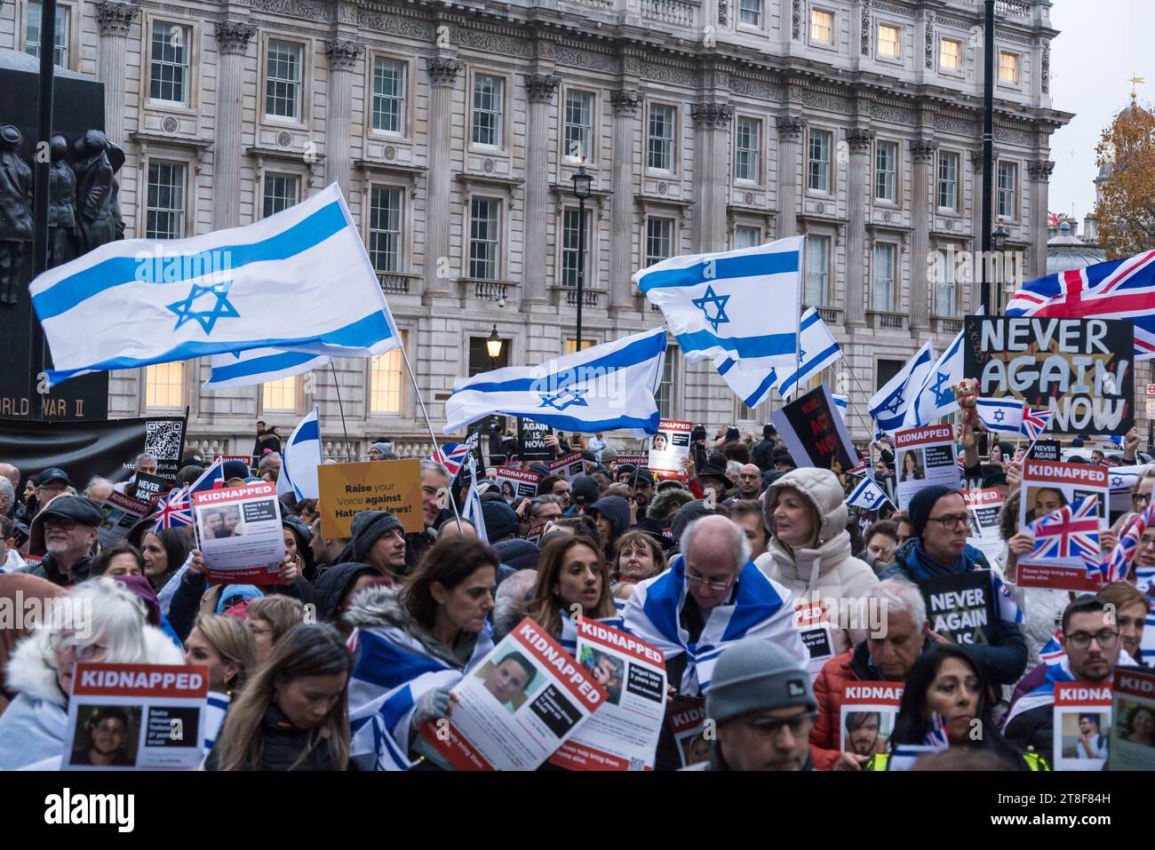 Protestors holding pictures of people kidnapped by Hamas, 'Never Again ...