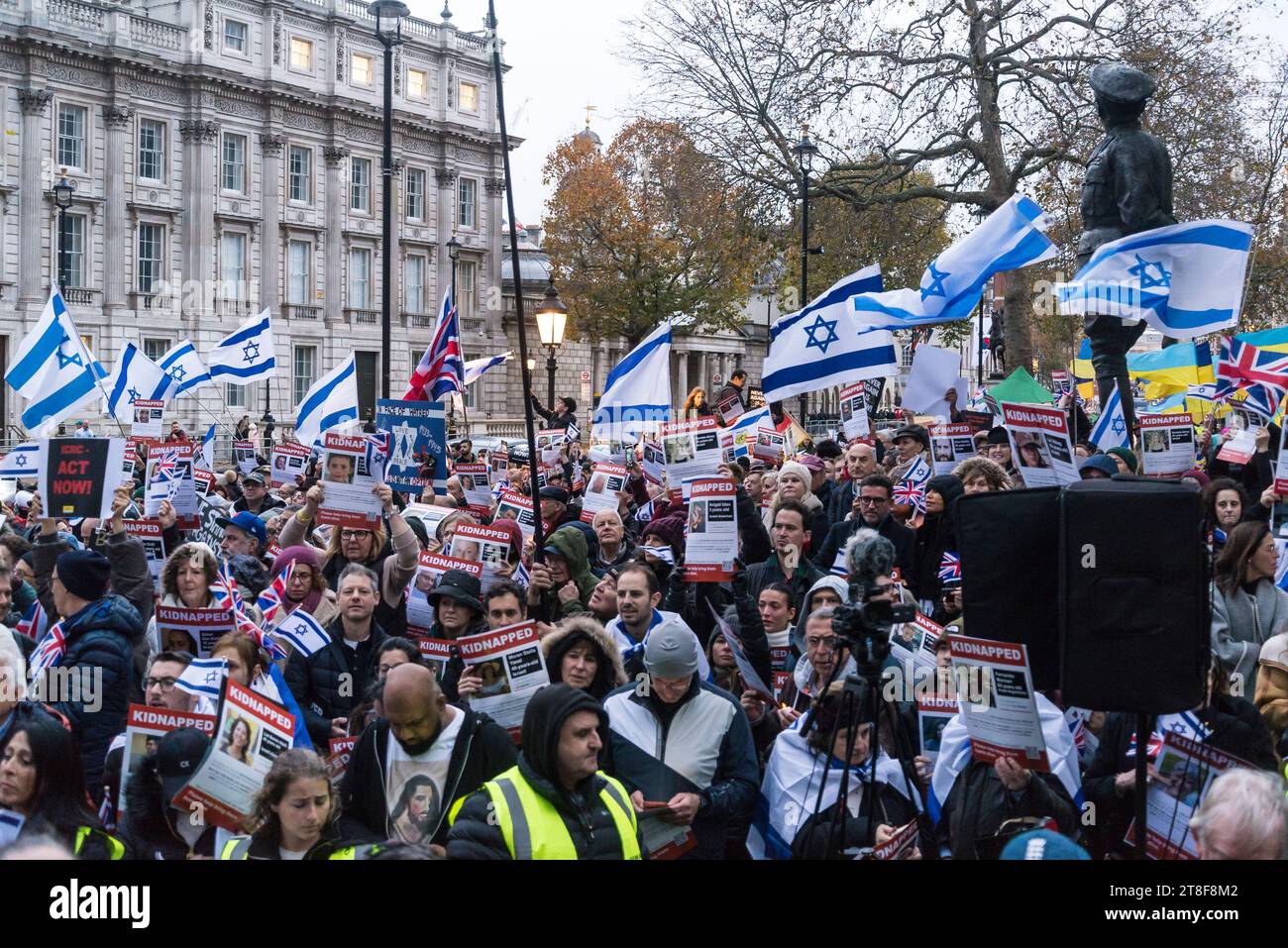 Protestors holding pictures of people kidnapped by Hamas, 'Never Again ...