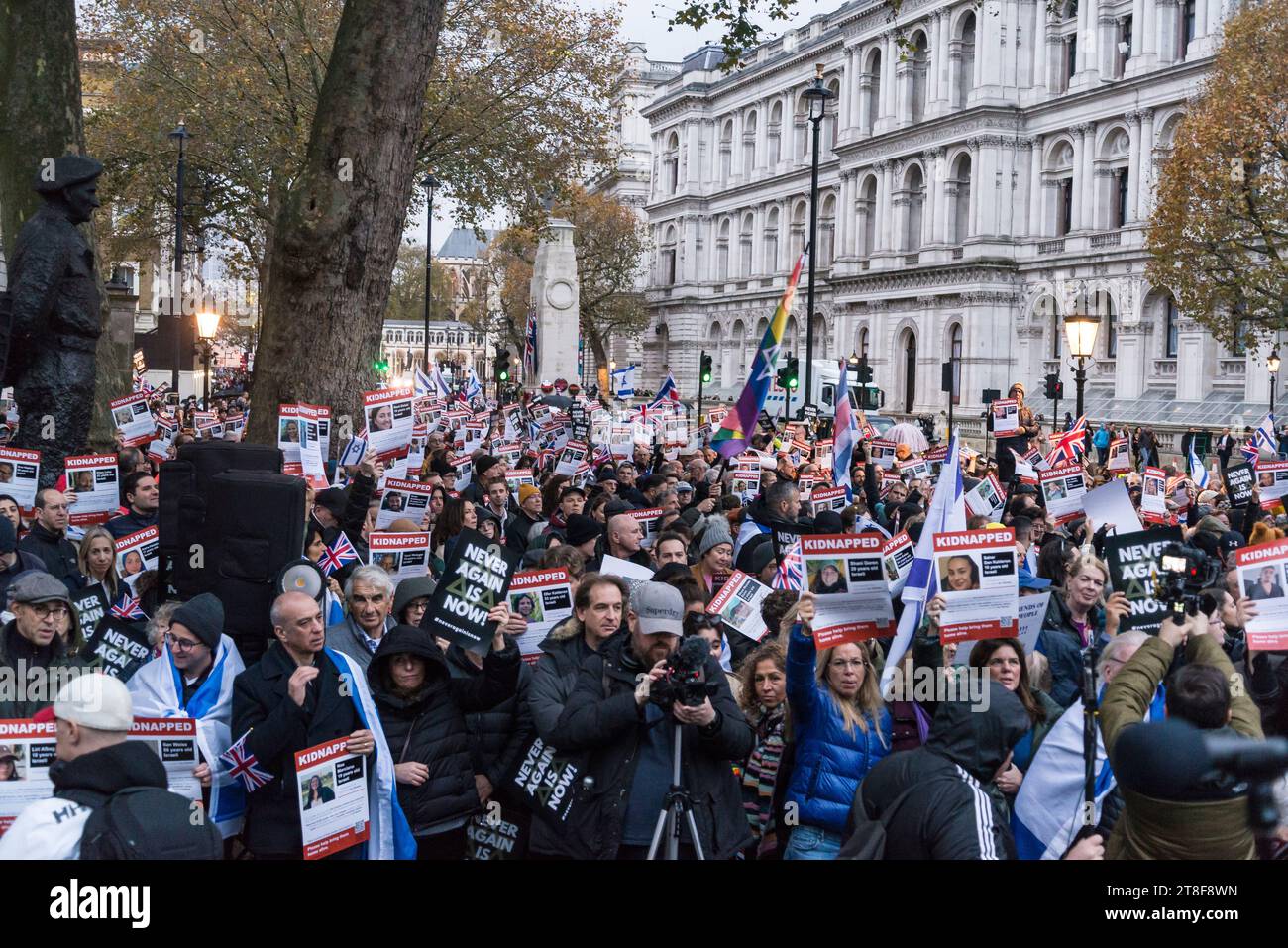 Protestors holding pictures of people kidnapped by Hamas, 'Never Again ...