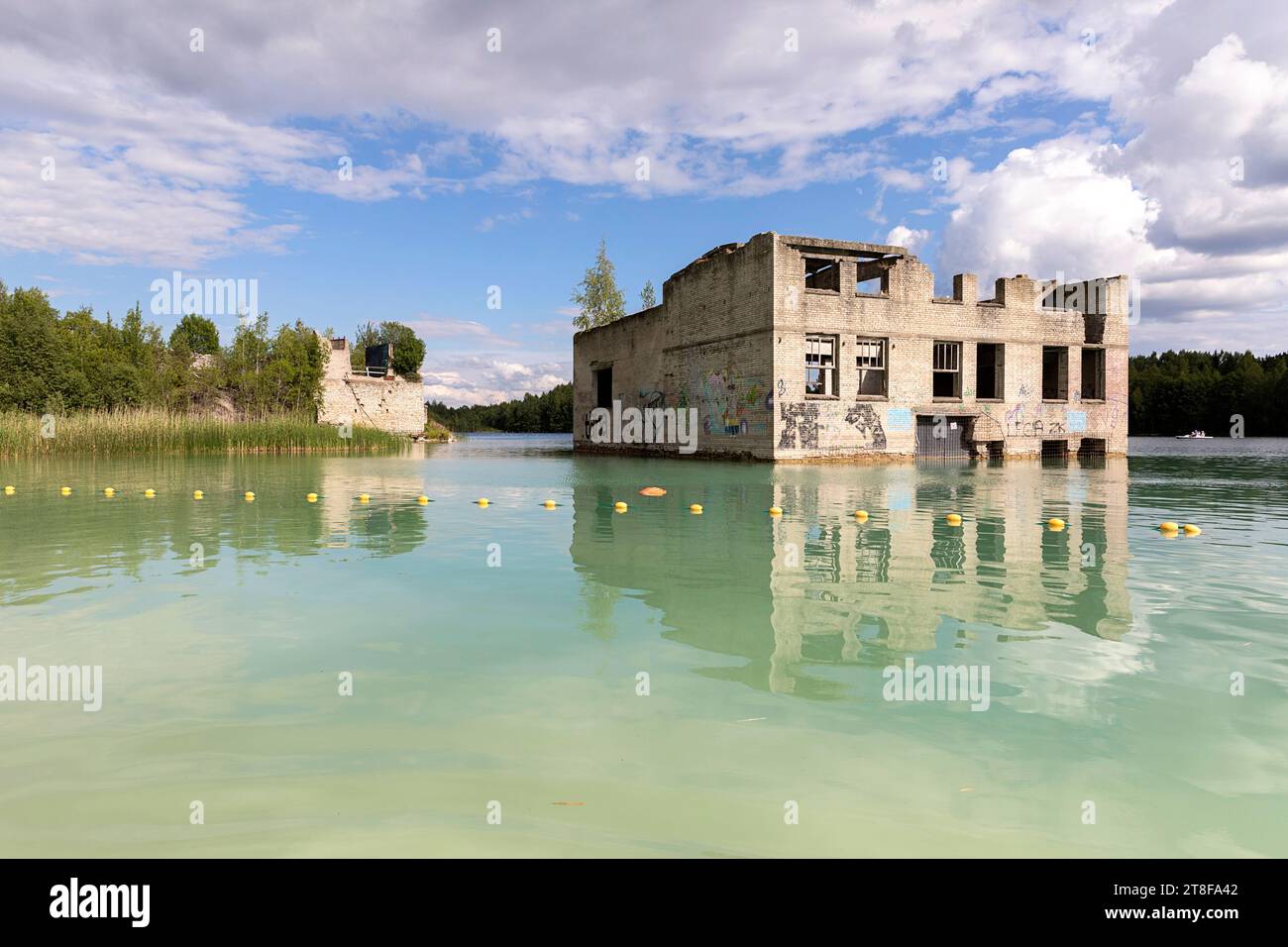 Abandoned building in Scenic Rummu quarry, former prison that was transformed to a place for tourism, for hiking swimming, Harju, Estonia Stock Photo