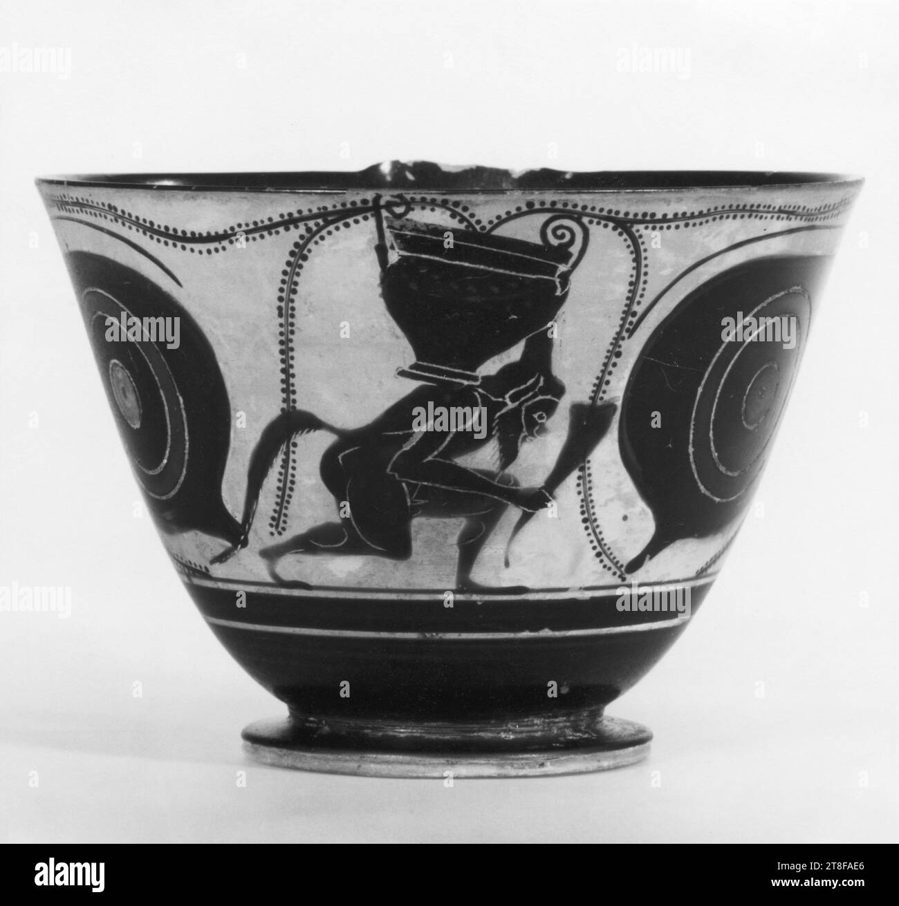 Kyathos with sirens, eyes, and a silenus, carrying a krater and a