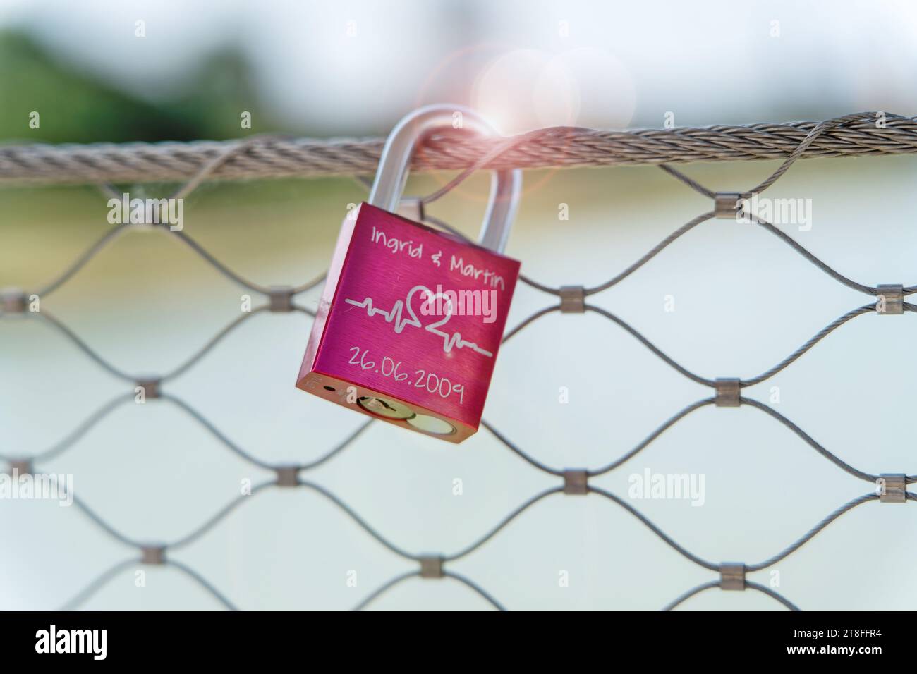 Metal padlock closed on the bridge, sign of lovers, hanging a padlock ...