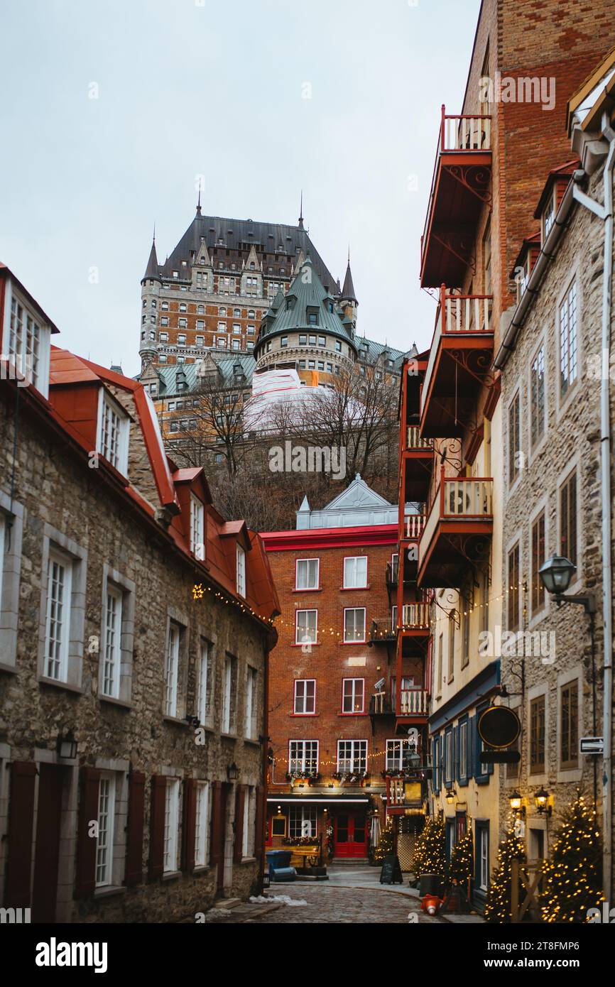 Quebec Building Style Charming cobblestone street lined with traditional European-style ...