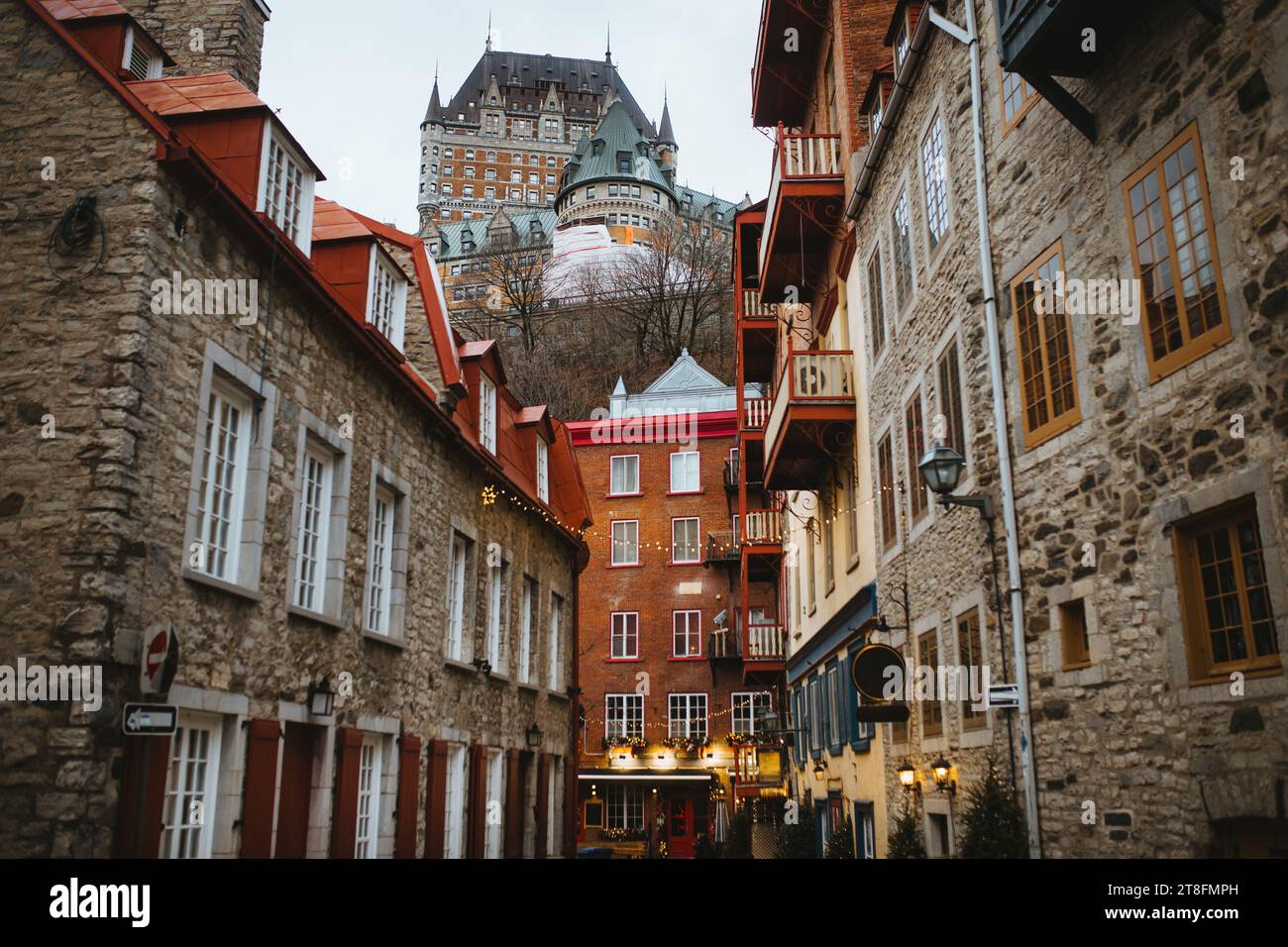 Cobblestone street flanked by traditional buildings under the watchful ...