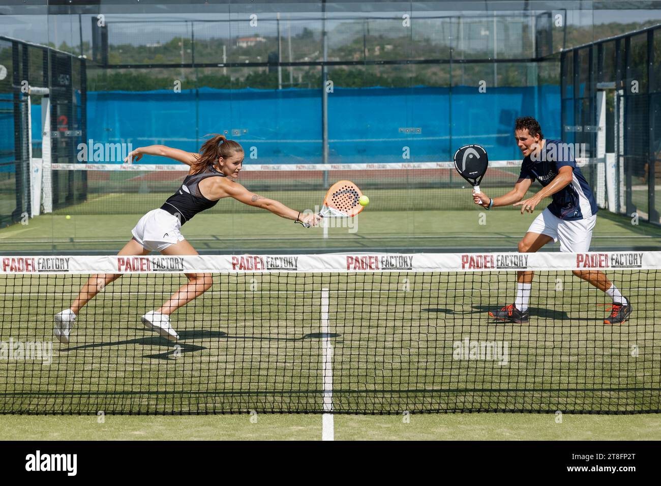 Young couple playing padel. tennis. Stock Photo