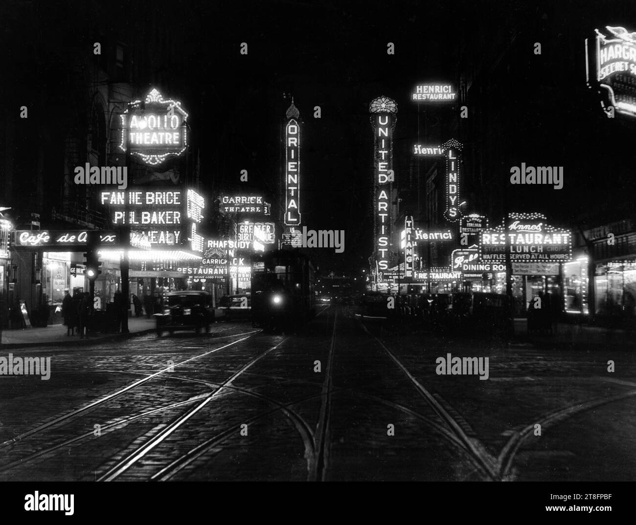 Chicago's theater row on Randolph Street looking east in downtown Chicago, circa 1920. Theaters pictured include the Oriental, the United Artists, the Garrick, and the Apollo. Stock Photo