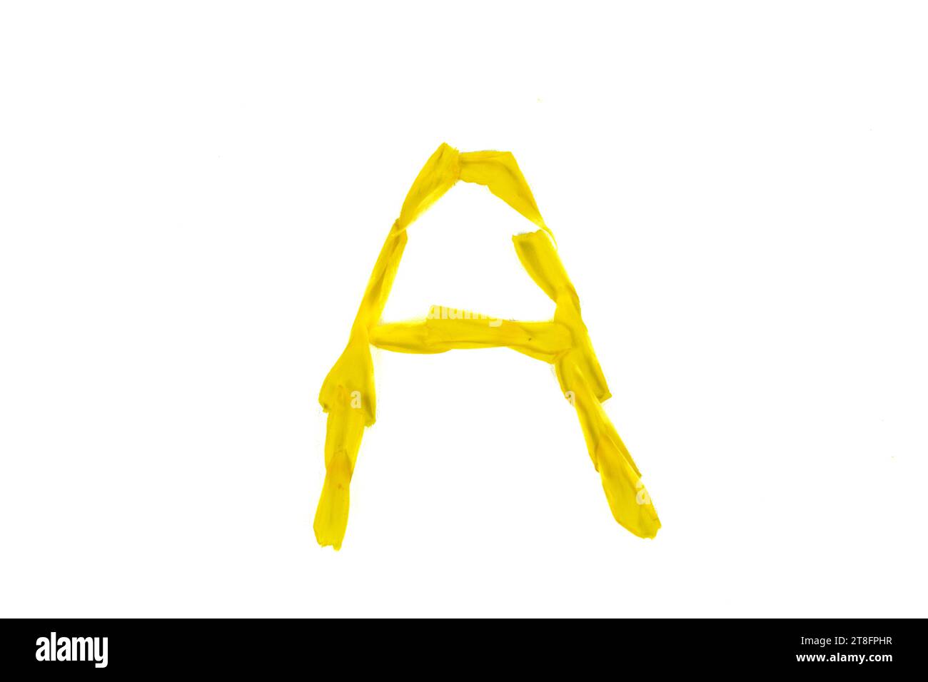 Letter A made from Damiana flower petals on a white background Stock Photo