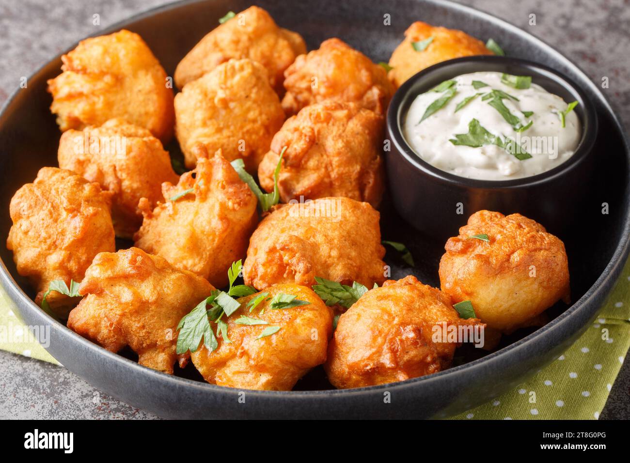 Hush puppies is made with eggs, onion, selfrising flour, and cornmeal