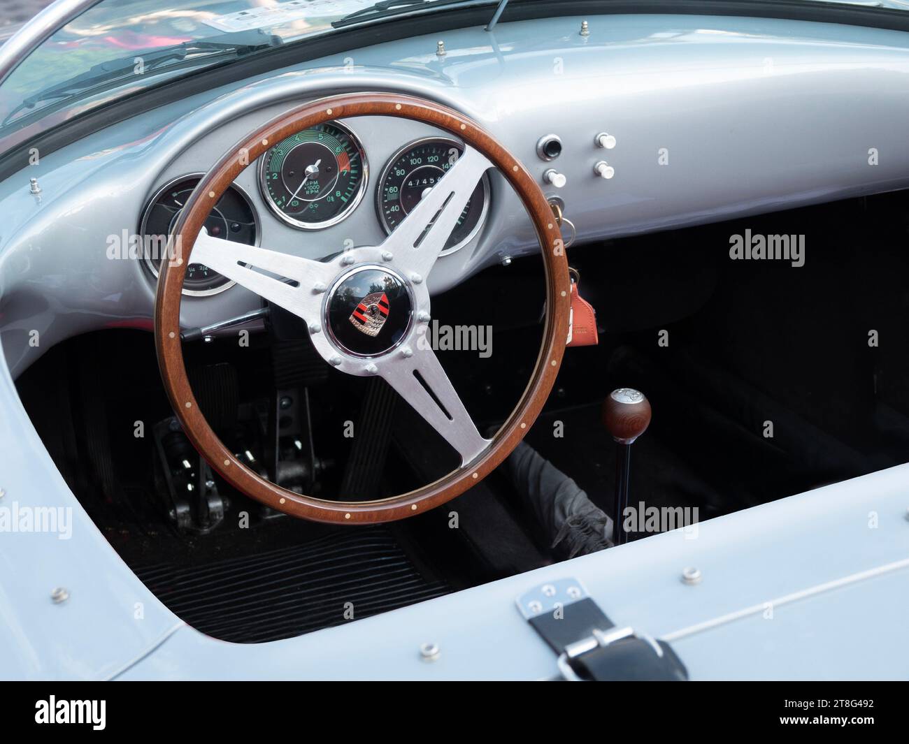 Interior of a Porsche 550 Spyder sports car - a light‑weight, high‑speed icon from 1950s. A car in which James Dean met a tragic end on route 466 in C Stock Photo