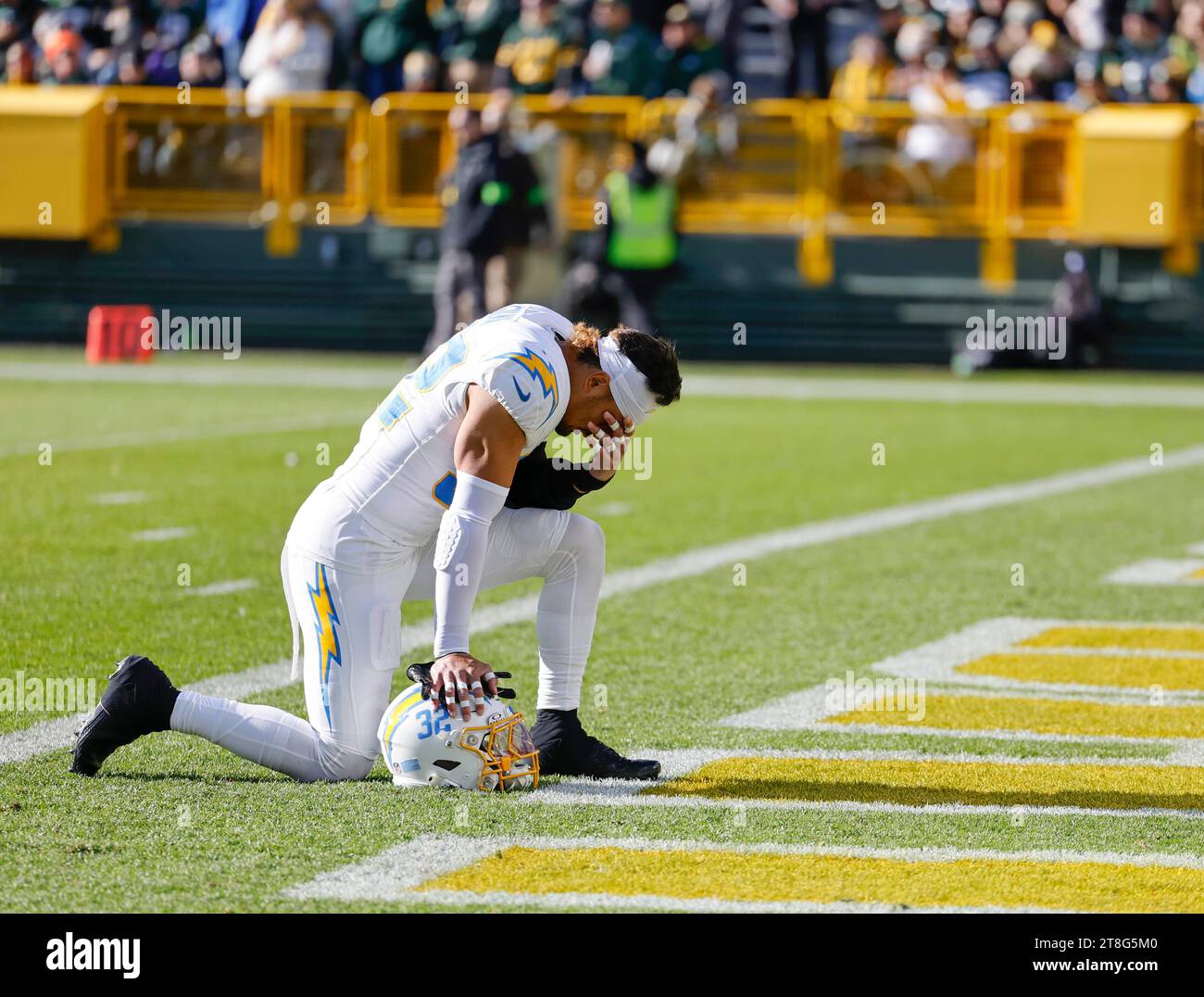 Los Angeles Chargers safety Alohi Gilman (32) pauses on the field before an NFL football game between the Green Bay Packers and the Los Angeles Chargers Sunday, Nov. 19, 2023, in Green Bay, Wis. (AP Photo/Jeffrey Phelps Stock Photo