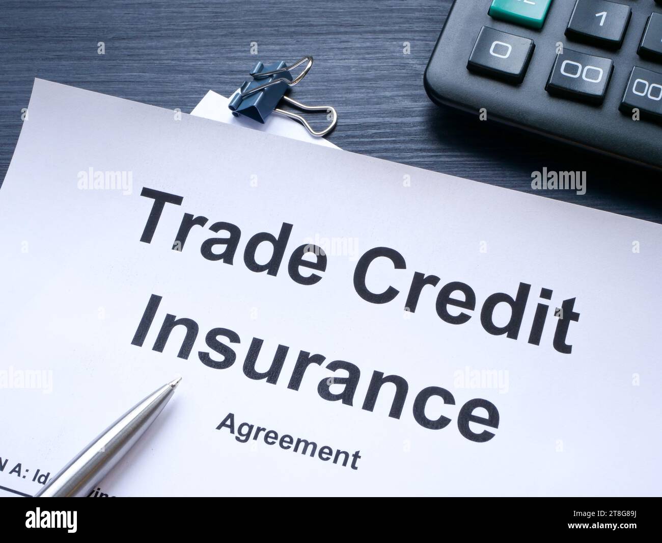 Trade credit insurance agreement and pen. Stock Photo