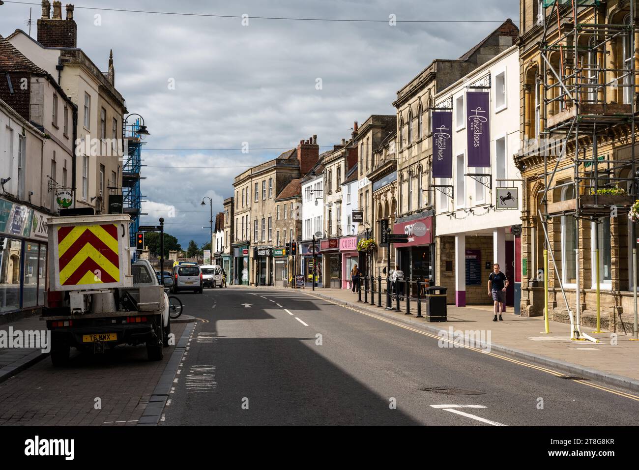 Shops and cafes line a traditional English High Street in Warminster ...