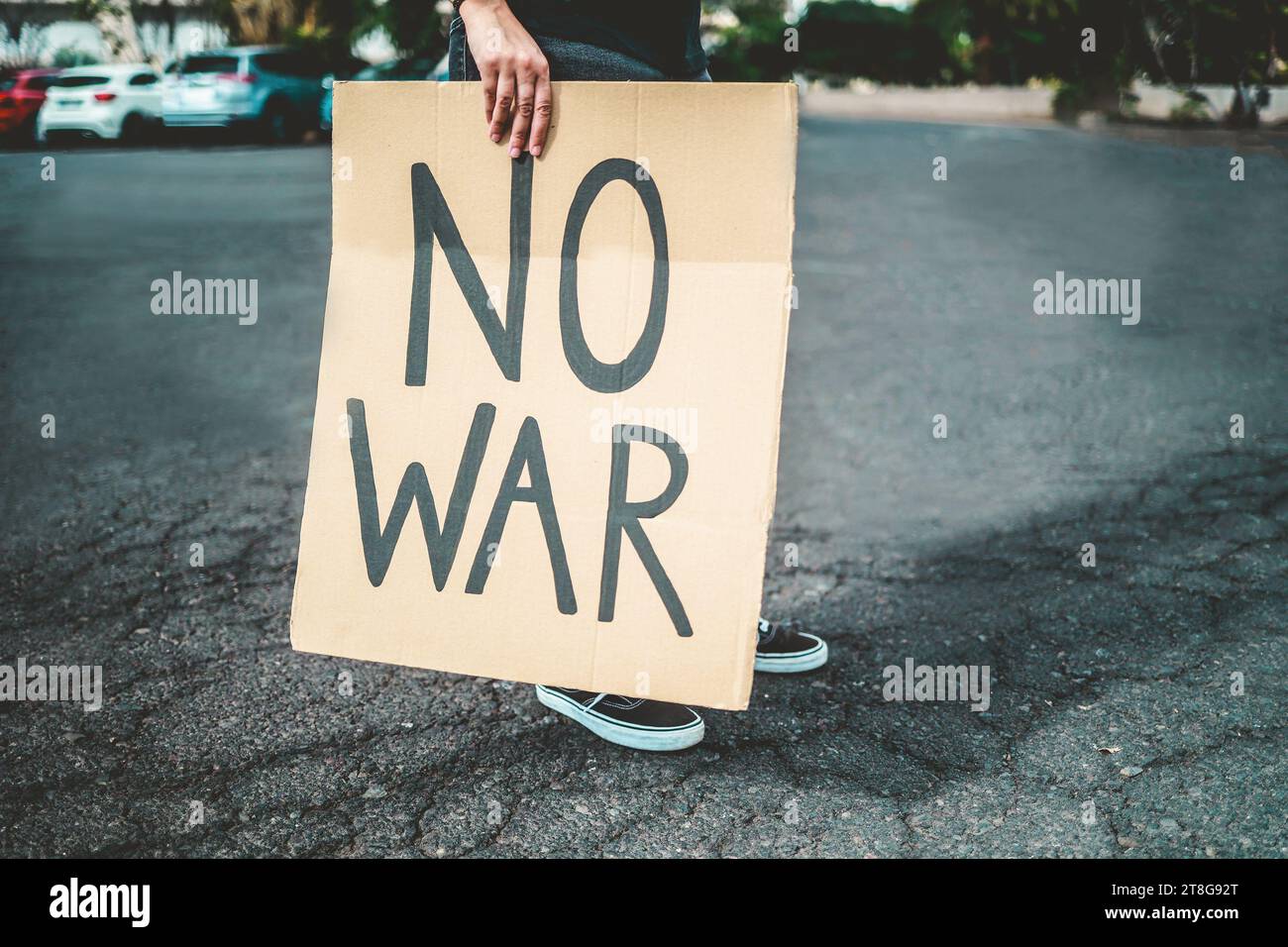 Stop war protest. Woman in crowd fighting against Israel and Palestine conflict. Black and white editing Stock Photo