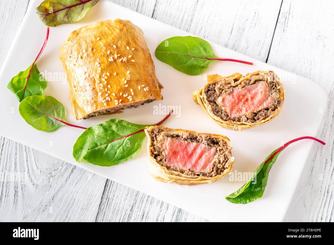 Slices of tuna wellington on the white backgound Stock Photo