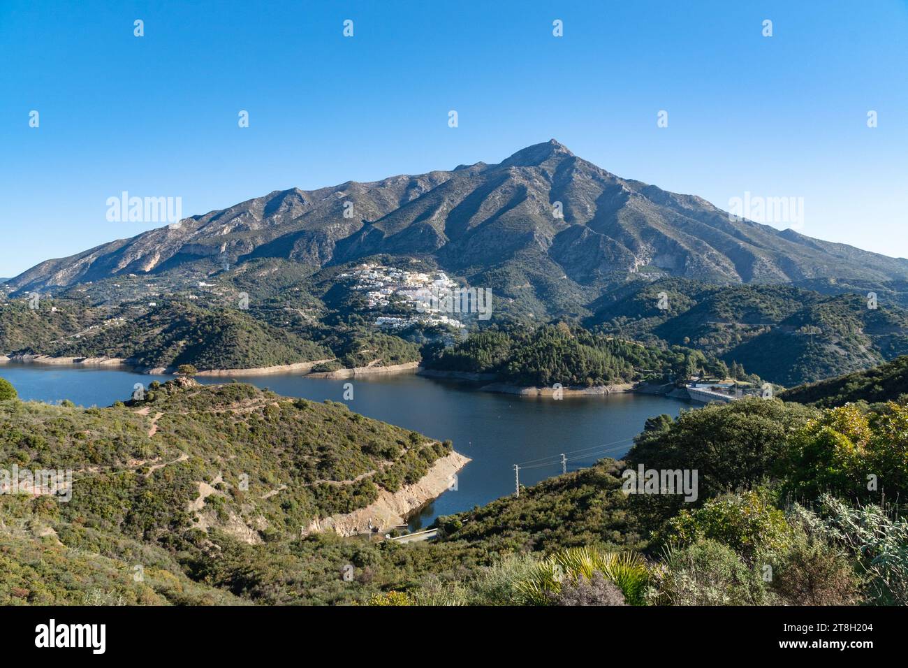 a view of the reservoir of Istan with La Concha Mountain behind. Stock Photo