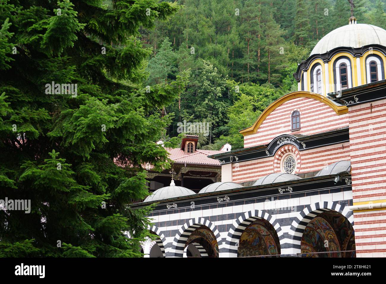 Rila Monastery: A Spiritual Haven in the Bulgarian Mountains, Nestled in the lush Rila Mountains of Bulgaria, the Rila Monastery stands as a magnificent testament to the country's rich history and spiritual heritage. This sacred site, founded in the 10th century, has not only served as a spiritual center for Orthodox Christianity but has also become a symbol of Bulgarian national identity and an architectural marvel. History and Origins, The Rila Monastery was established in the 10th century by Saint Ivan of Rila Stock Photo