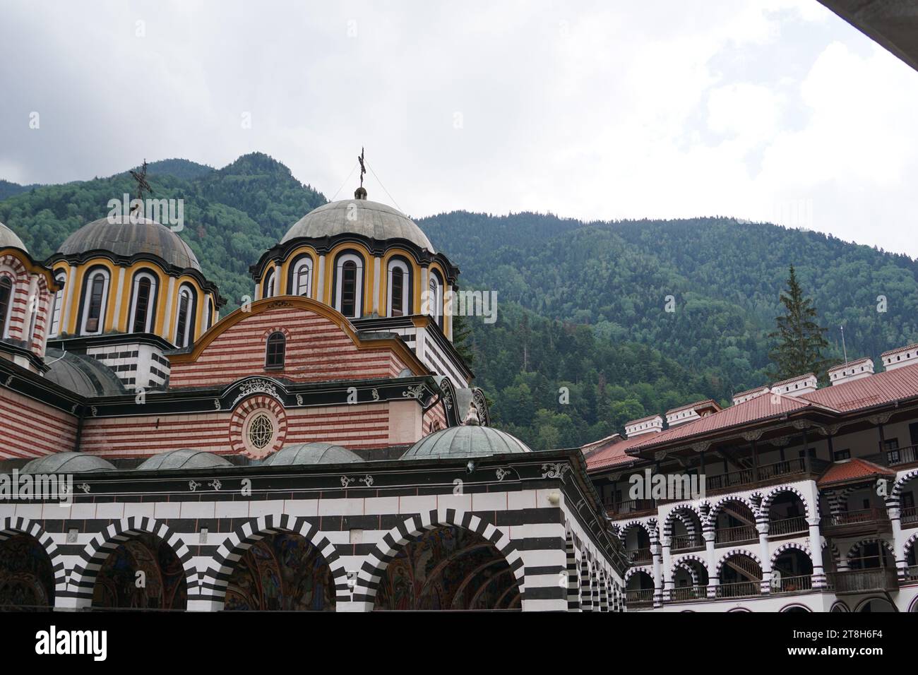 Rila Monastery: A Spiritual Haven in the Bulgarian Mountains, Nestled in the lush Rila Mountains of Bulgaria, the Rila Monastery stands as a magnificent testament to the country's rich history and spiritual heritage. This sacred site, founded in the 10th century, has not only served as a spiritual center for Orthodox Christianity but has also become a symbol of Bulgarian national identity and an architectural marvel. History and Origins, The Rila Monastery was established in the 10th century by Saint Ivan of Rila Stock Photo