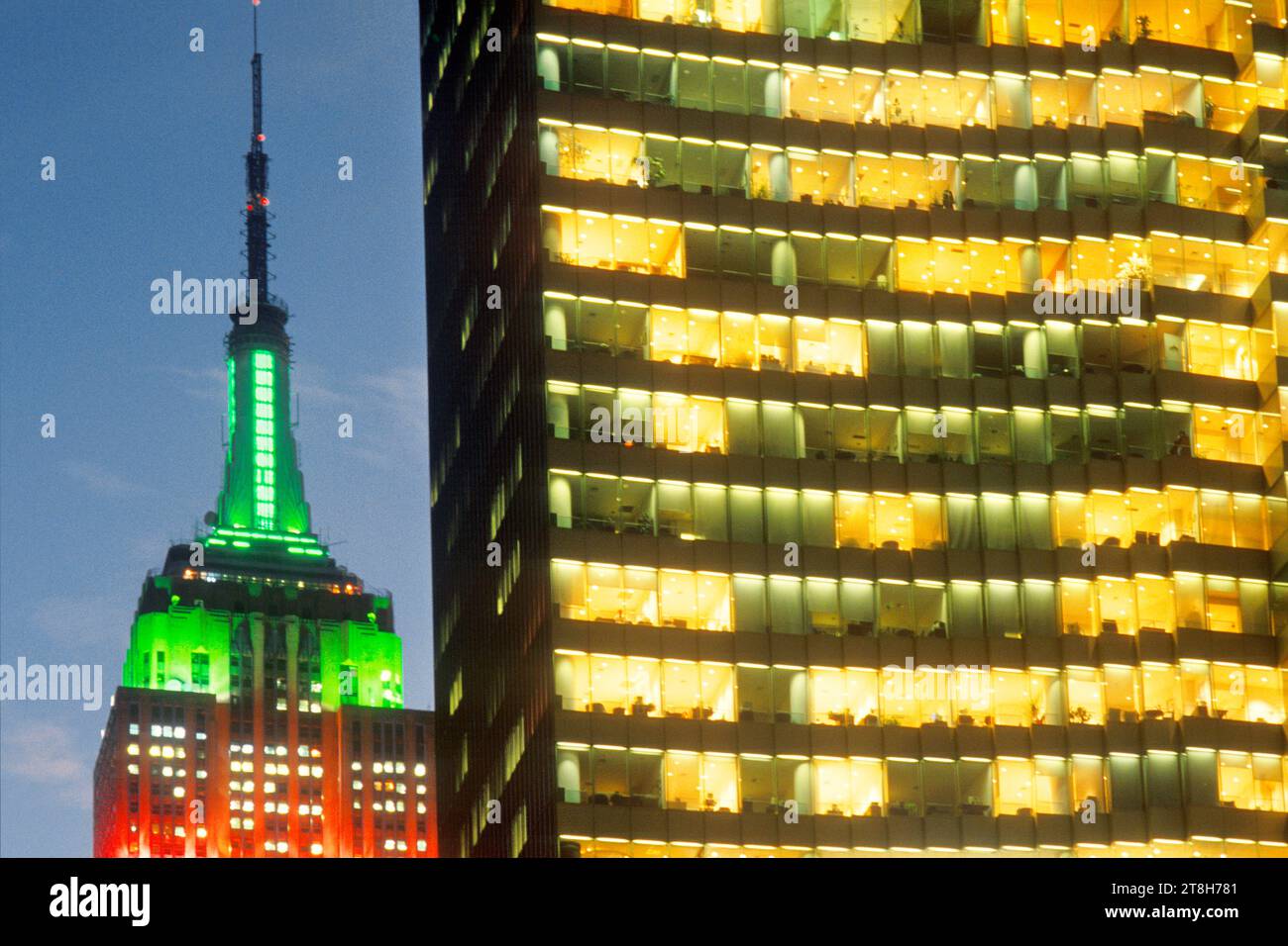 Empire State Building Christmas lights at night or dusk. New York City Midtown Manhattan office building skyscrapers illuminated on Fifth Avenue. USA Stock Photo