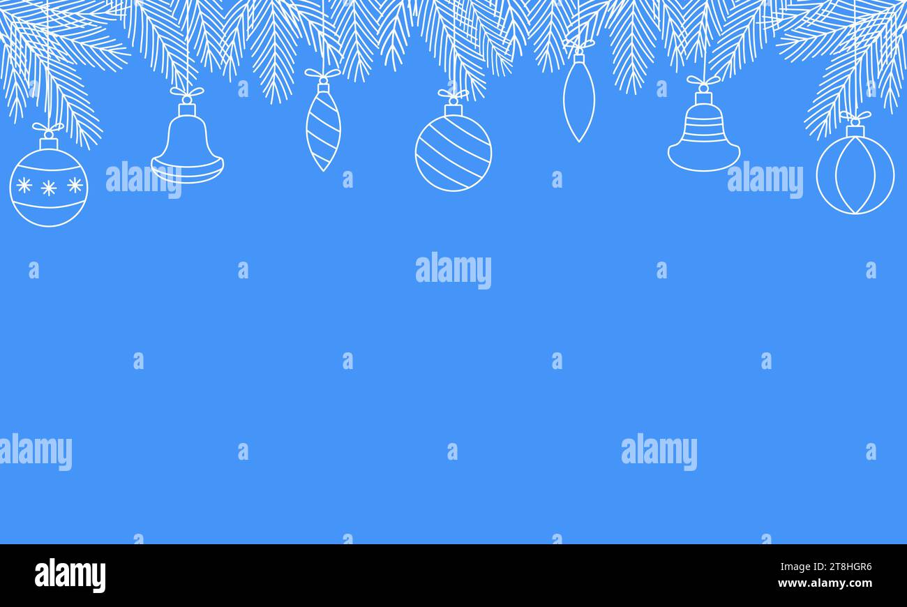 White frosted pine branches with festive balls on blue background ...