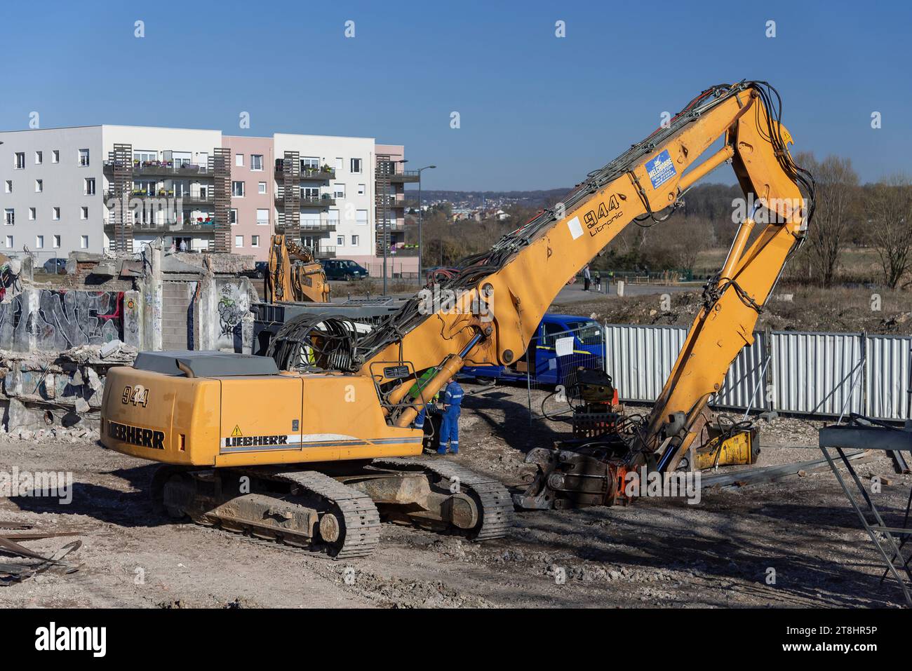 Nancy, France - Yellow crawler excavator Liebherr R 944 B in a demolition site. Stock Photo