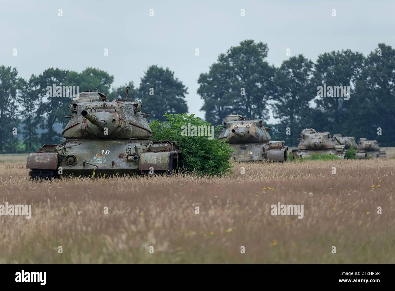 Sögel, Germany - Focus on abandoned American tanks in the middle of a field in Germany. In total there are 24 tanks in this field. Stock Photo