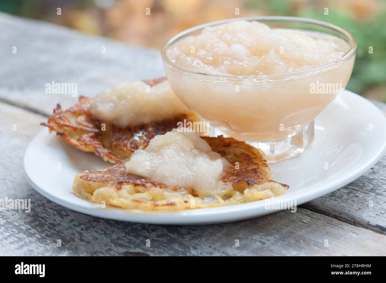 Traditional German potato pancakes with home made apple sauce. Stock Photo