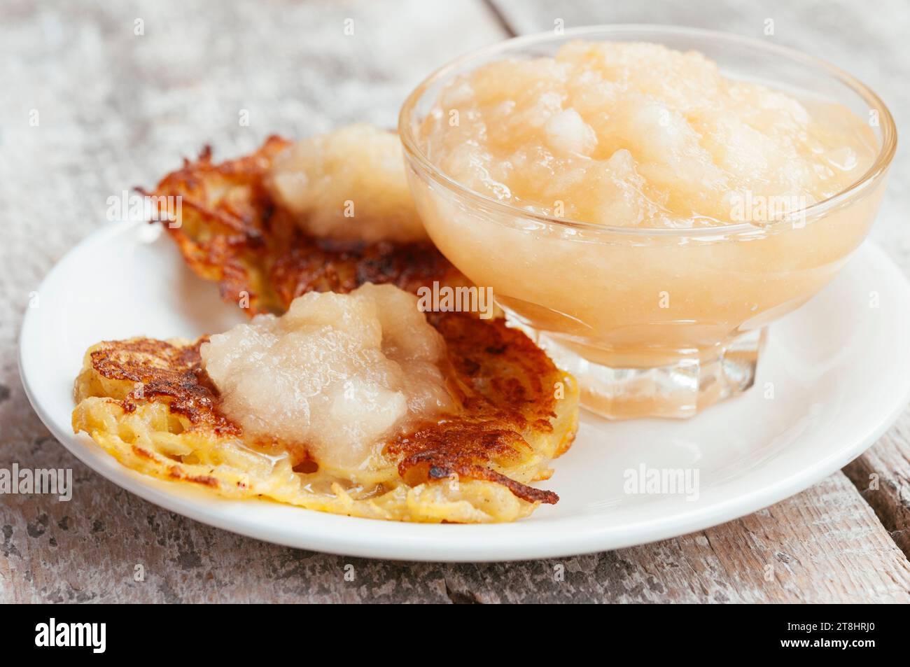 Traditional German potato pancakes with home made apple sauce. Stock Photo