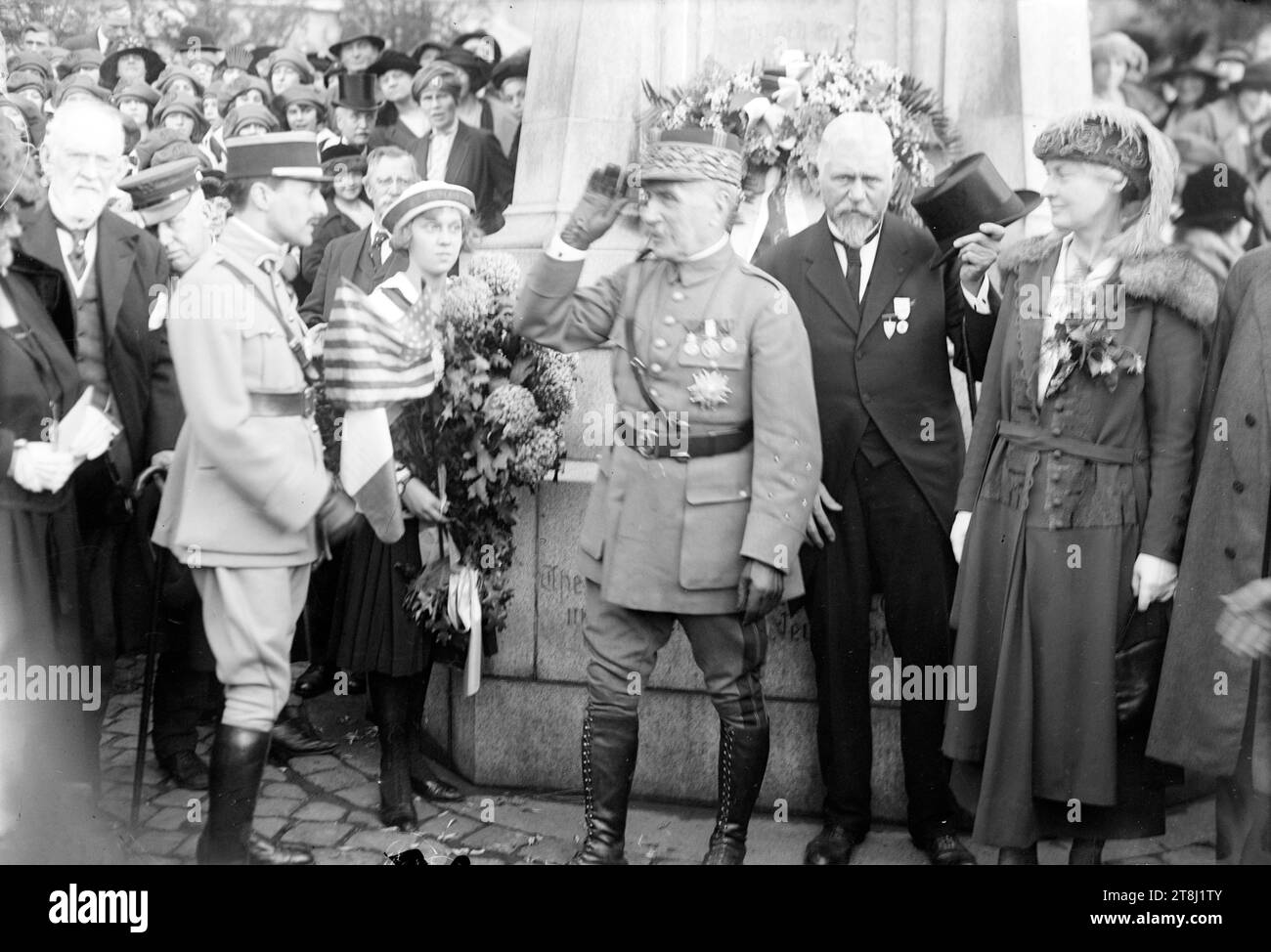 Marshal Ferdinand Jean Marie Foch (1851-1929), a French general who served as the Allied Supreme Allied Commander during the last year of World War I with mineralogist George Frederick Kunz (1856-1932) at a ceremony held at the Joan of Arc statue in New York City. Also in the photo, standing at the right, is Anna Vaughn Hyatt Huntington, sculptor of the Joan of Arc statue, and Jacqueline Vernot holding flowers. Stock Photo