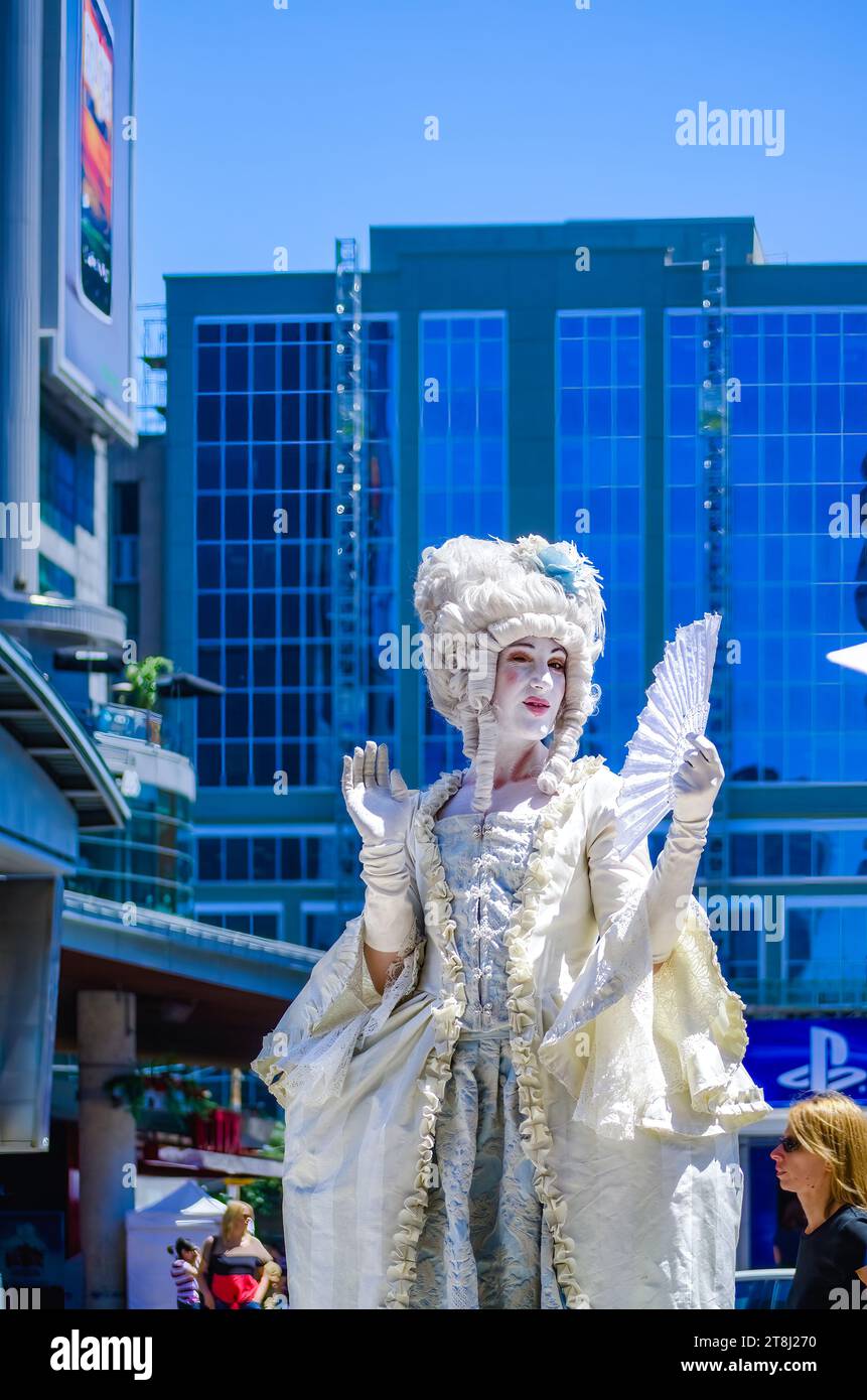 A person with a stage costume busking in Yonge-Dundas Square, Toronto, Canada Stock Photo