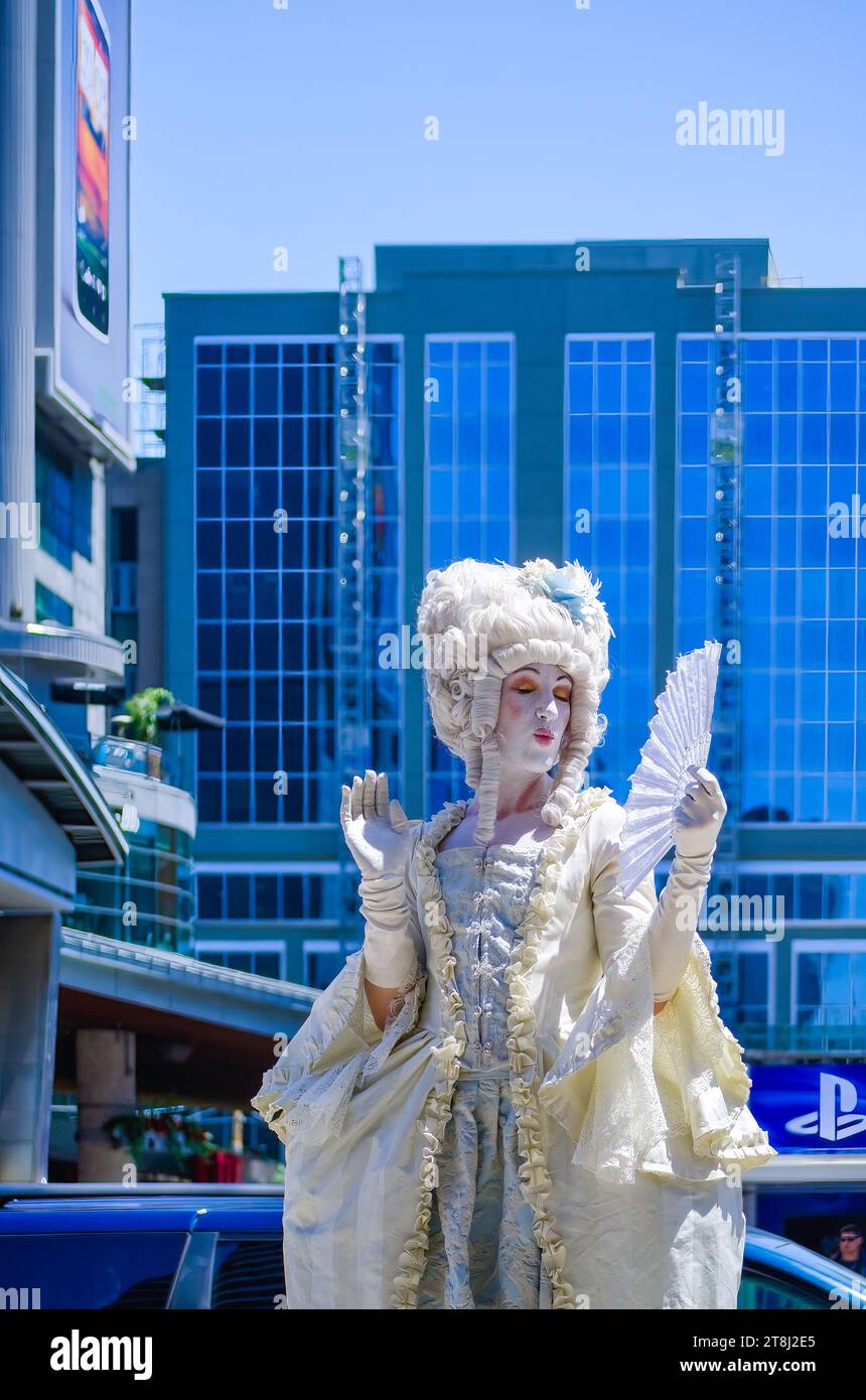 A person with a stage costume busking in Yonge-Dundas Square, Toronto, Canada Stock Photo