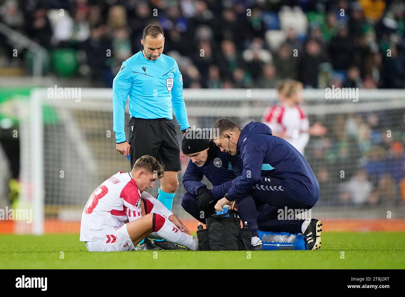 Jesper Lindstroem Denmark (18) receives medical attention after ...