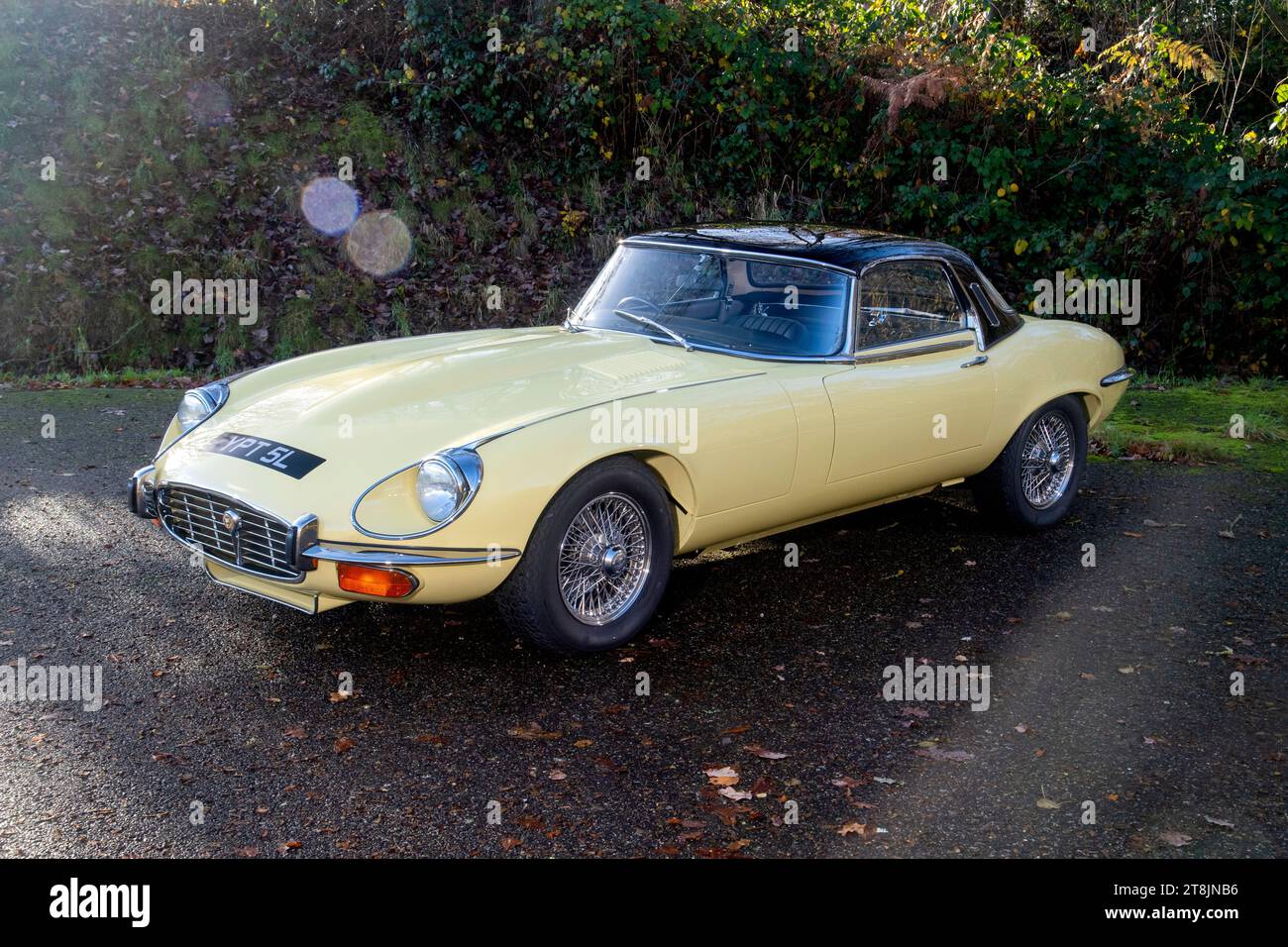 !973 Jaguar E Type Series 3 V12 classic British Sports car in red and yellow Stock Photo