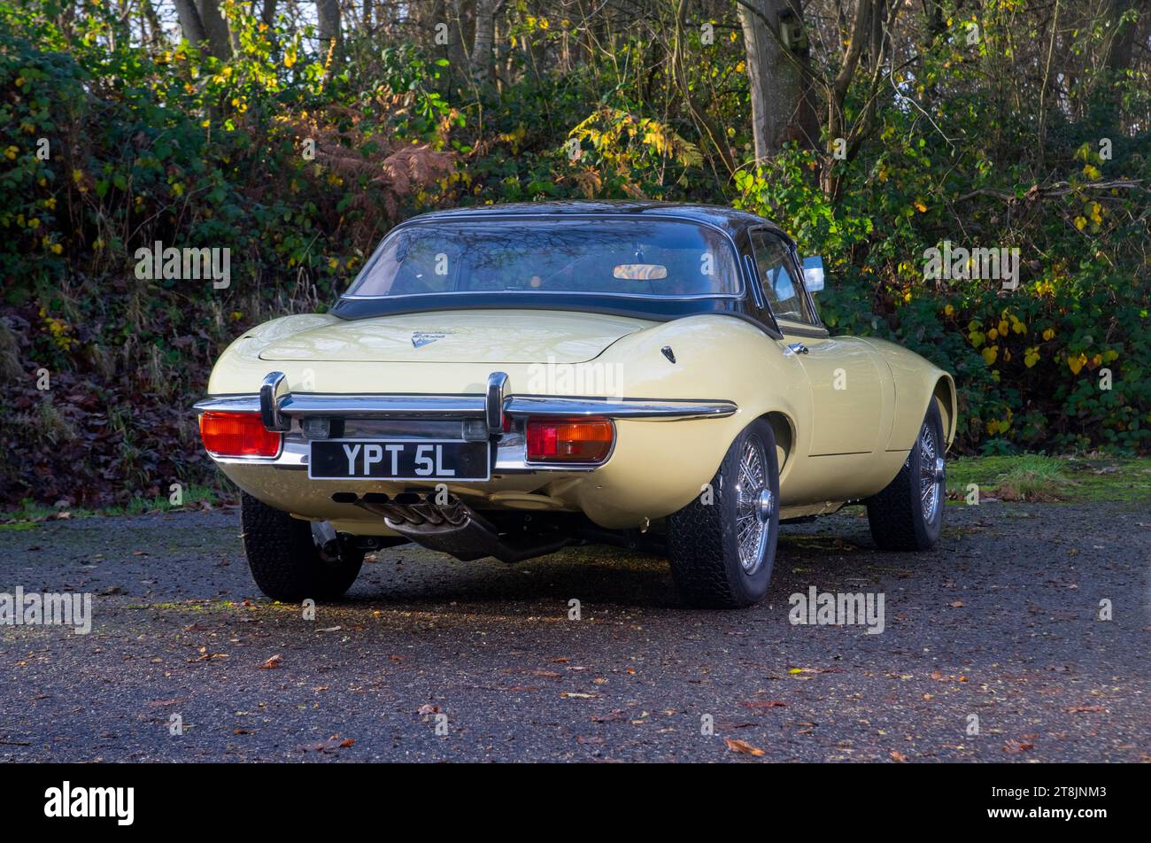 !973 Jaguar E Type Series 3 V12 classic British Sports car in red and yellow Stock Photo