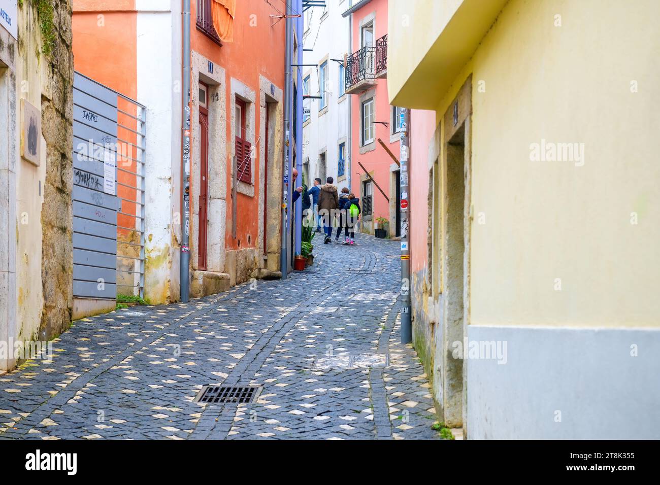 LISBON, PORTUGAL, tourists in narrow cobblestone street Stock Photo - Alamy