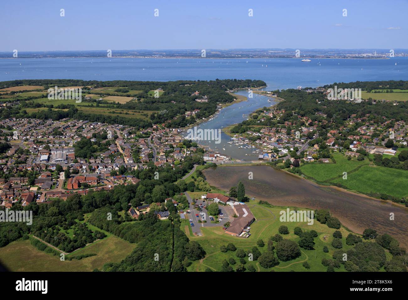 Aerial view of Fishbourne and the town of Wootton Bridge overlooking Wootton Creek on the Isle of Wight, accross The Solent,  Portsmouth and Lee-On-So Stock Photo