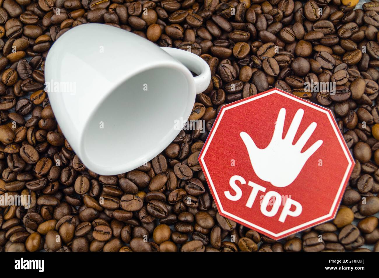 roasted coffee beans and cup with stop sign Stock Photo Alamy