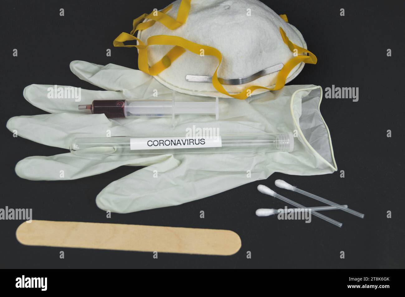 Corona test tubule, mask, syringe, latex glove, cotton swab and spatula Stock Photo