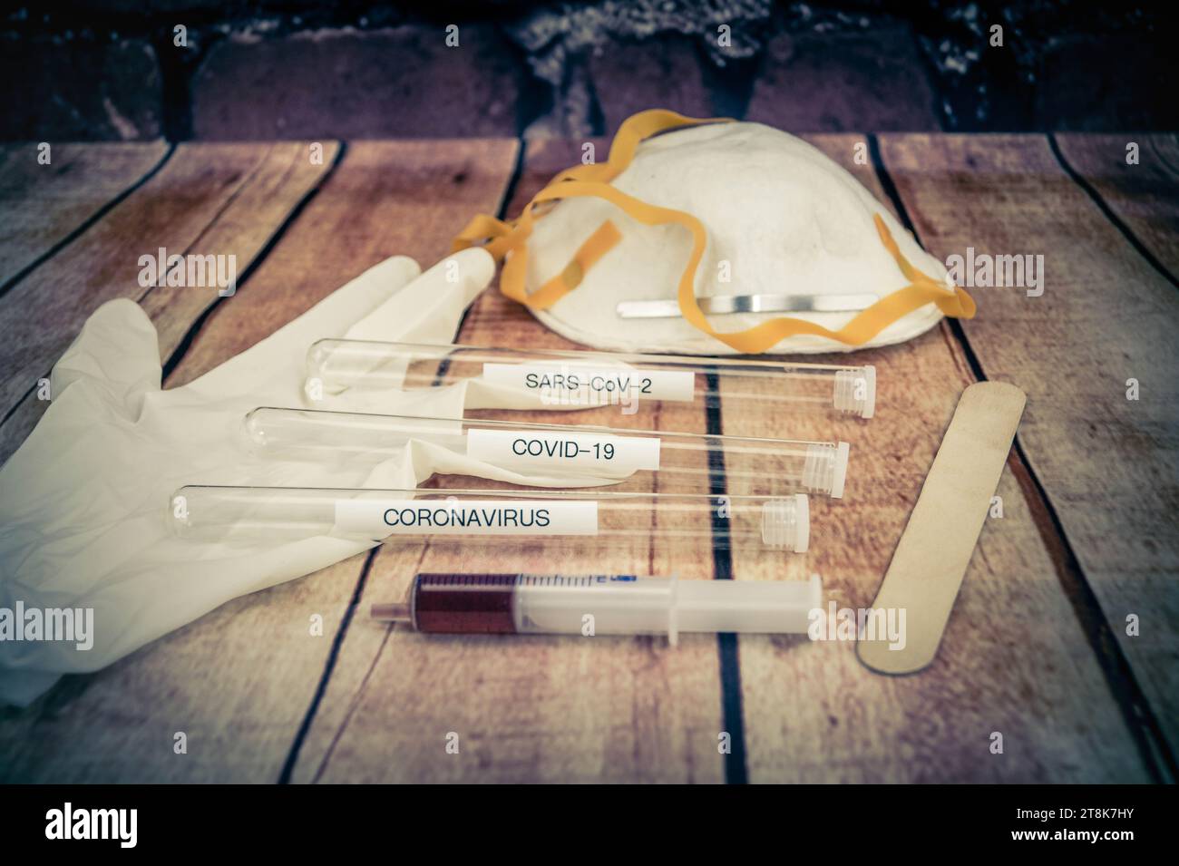 Corona test tubule, syringe, latex glove, cotton swab, mask and spatula Stock Photo